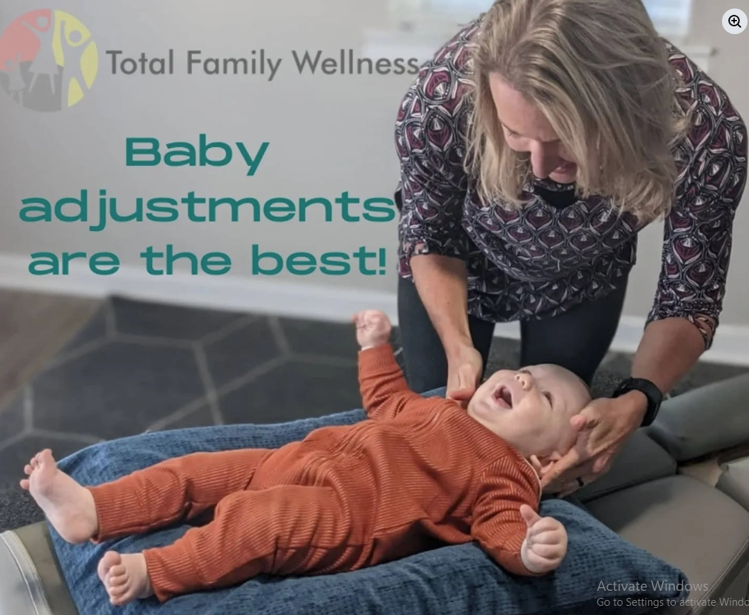 Pediatric chiropractor Dr. Nichole Quinn gently adjusting a baby in North Charleston, SC